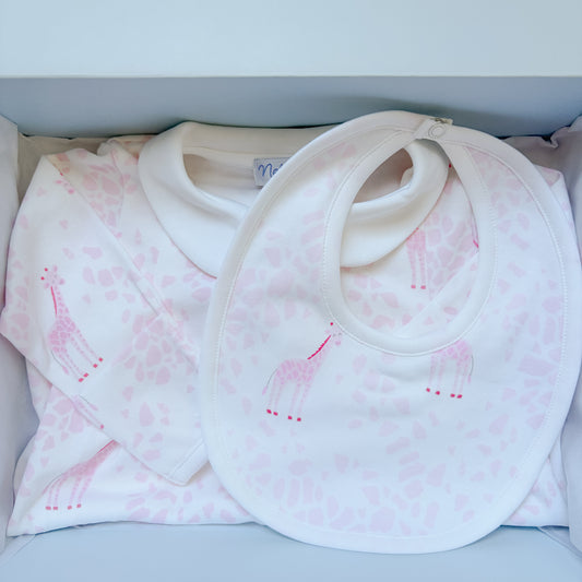 the pink giraffe gift box set with a gown and bib