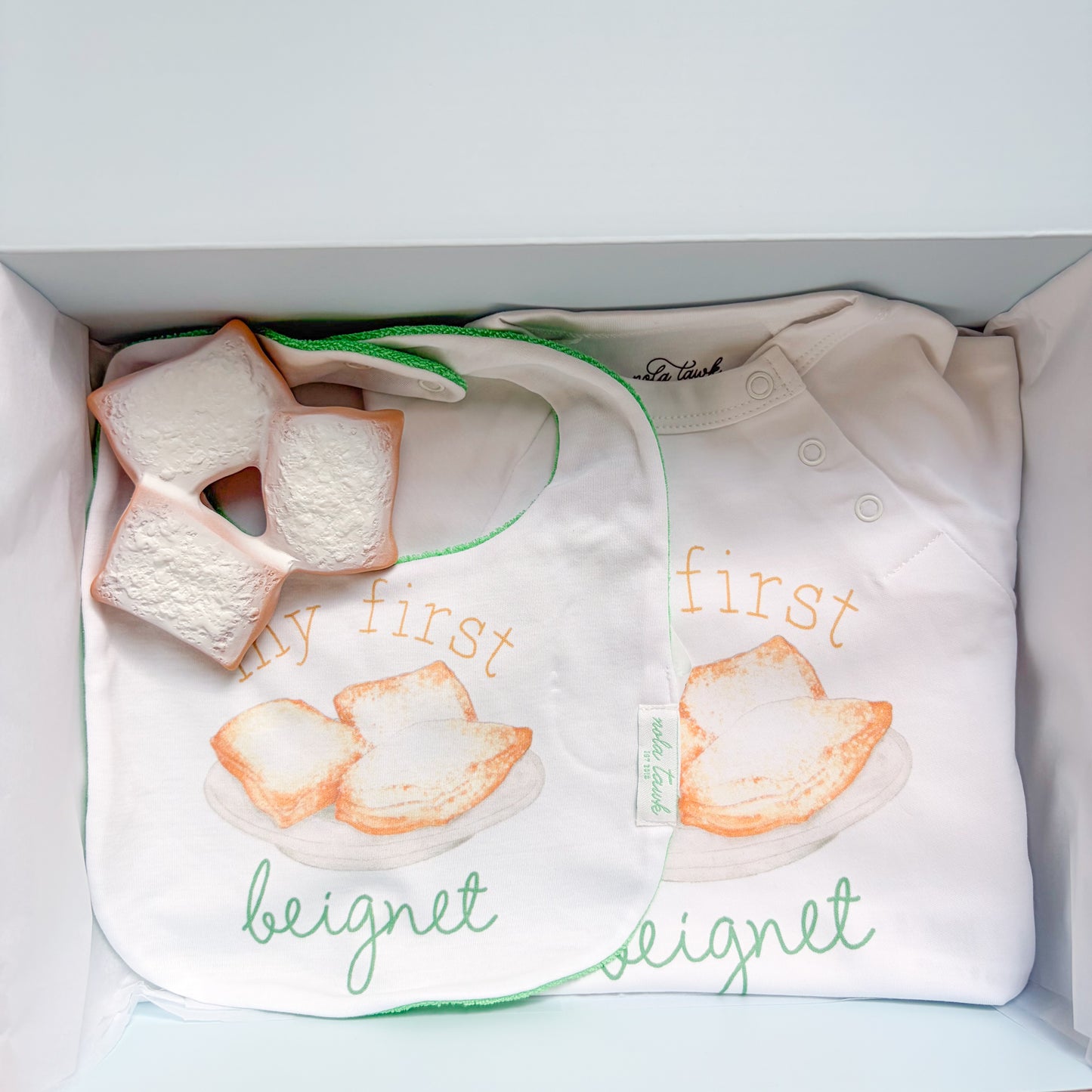 beignet gift box with a bib, onsie and teether
