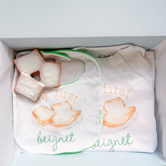 beignet gift box with a bib, onsie and teether