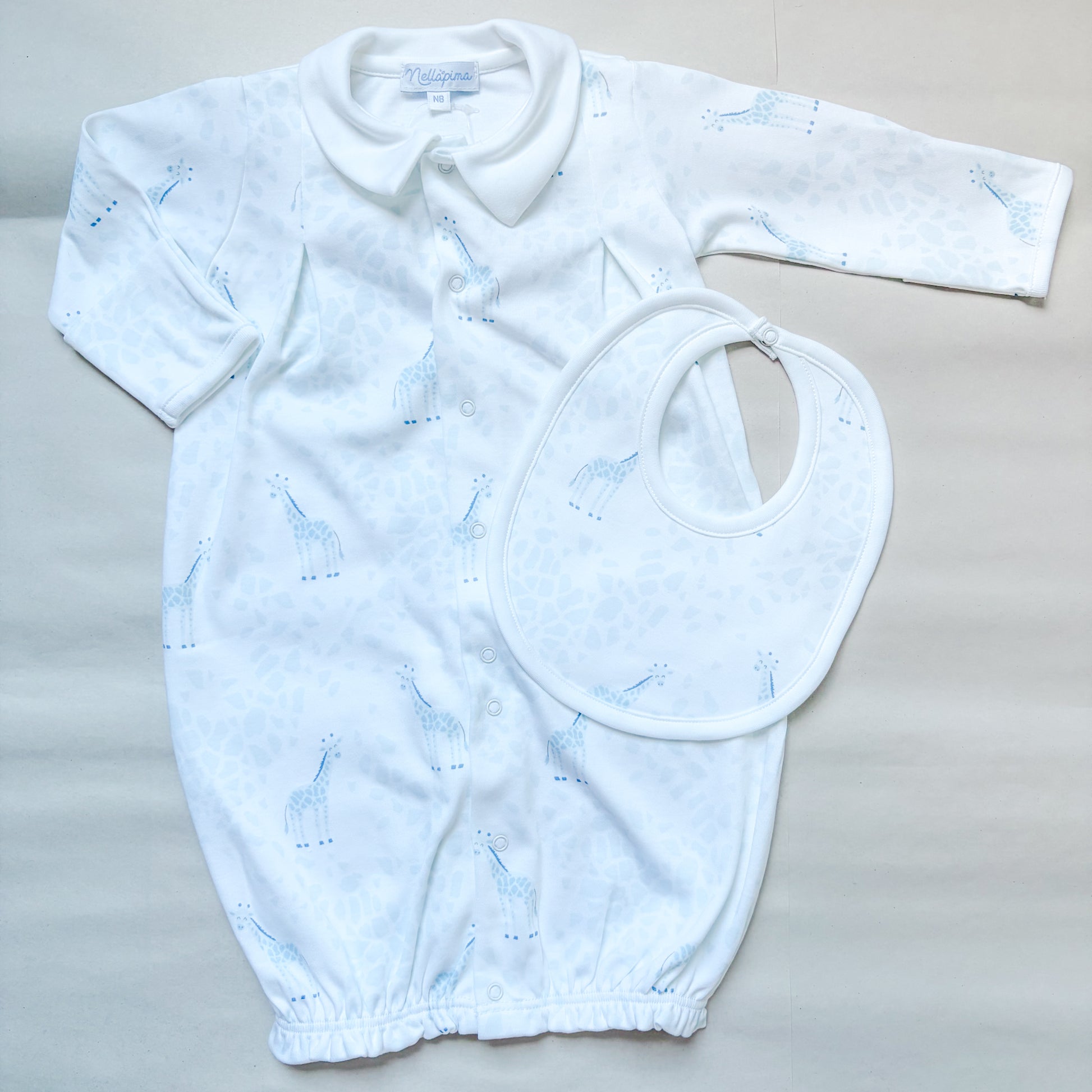 the blue giraffe gift box with a baby gown and bib